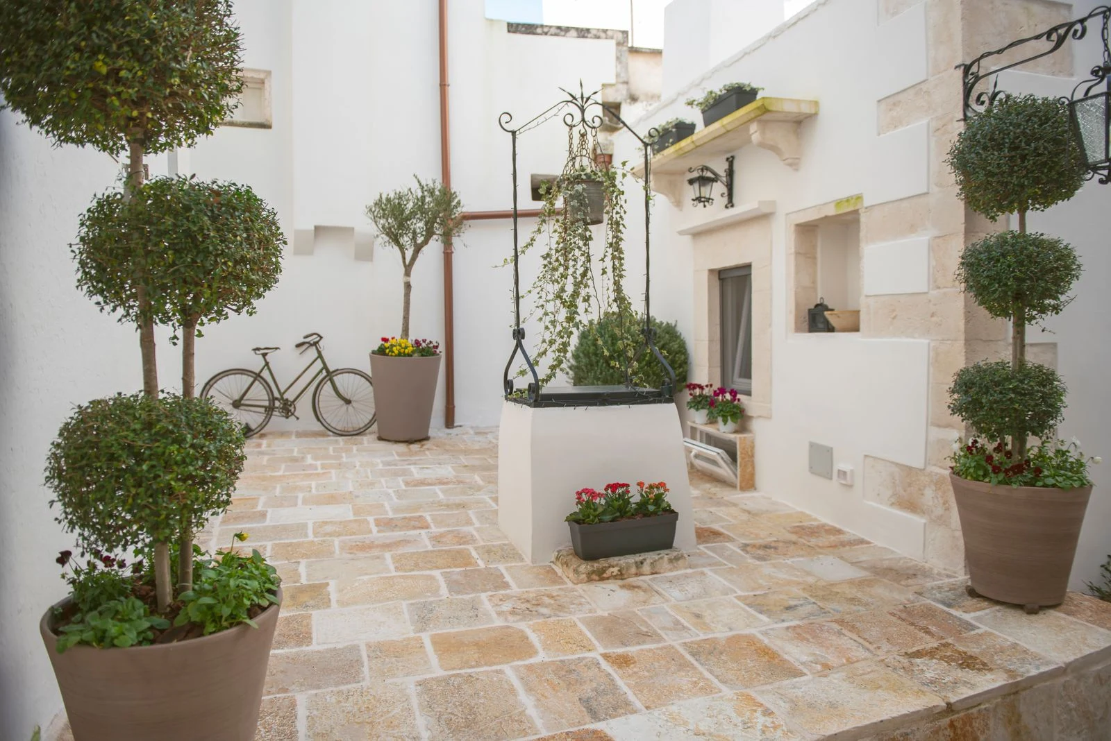 The historic courtyard at L'Antico Pozzo Relais